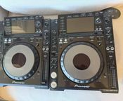 a pair of pioneer cdj 2000 nexus
 - Image