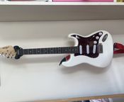 white-red austin stratocaster electric guitar
 - Image